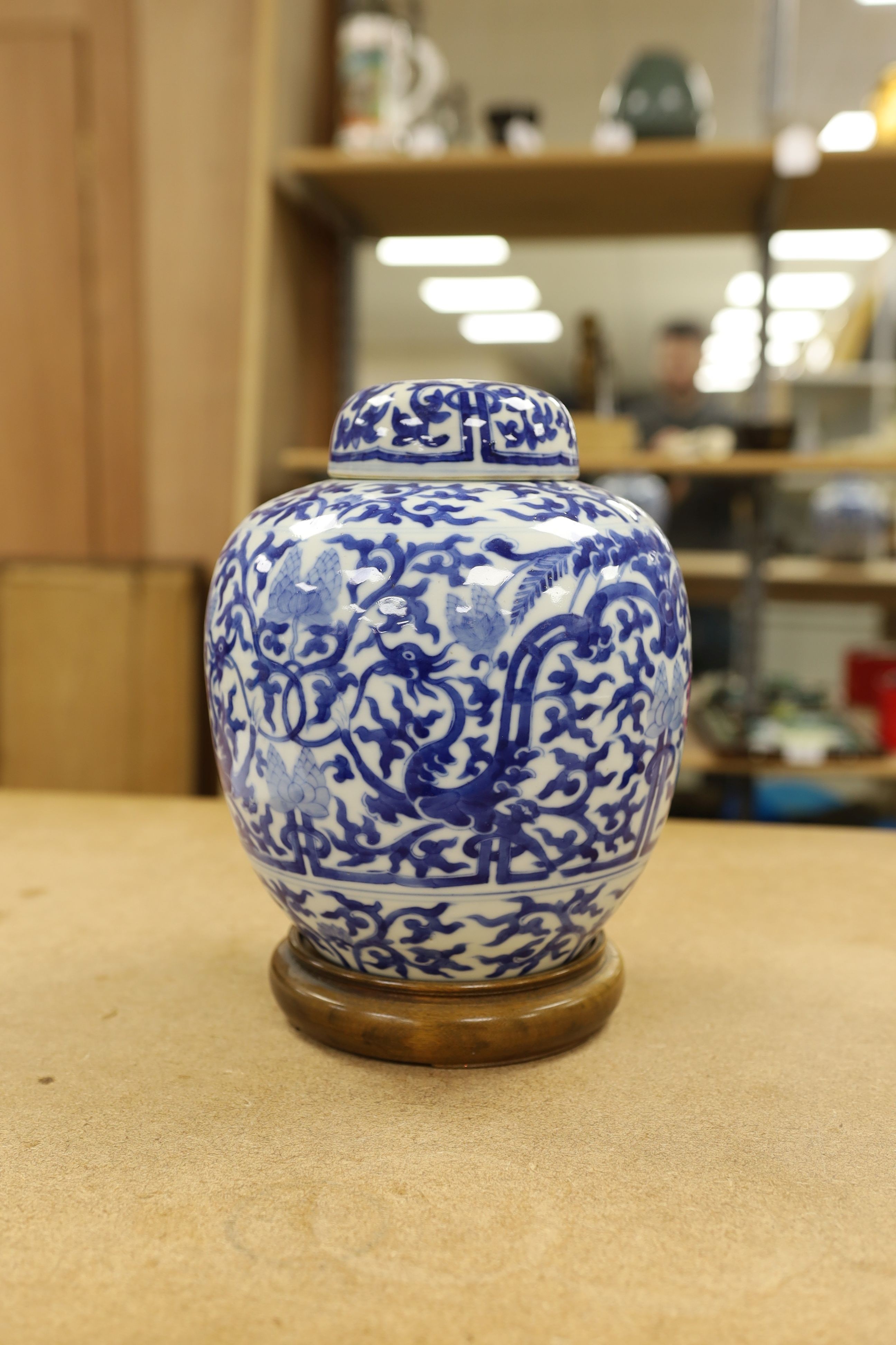 A pair of Chinese blue and white ginger jars and covers, 22cm, On stands